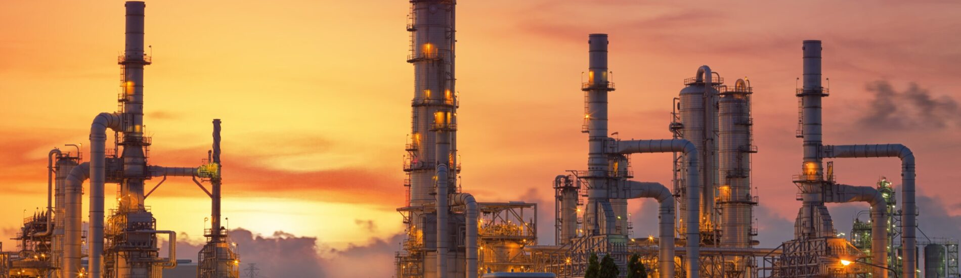 Oil refinery at twilight sky close up to pipe line